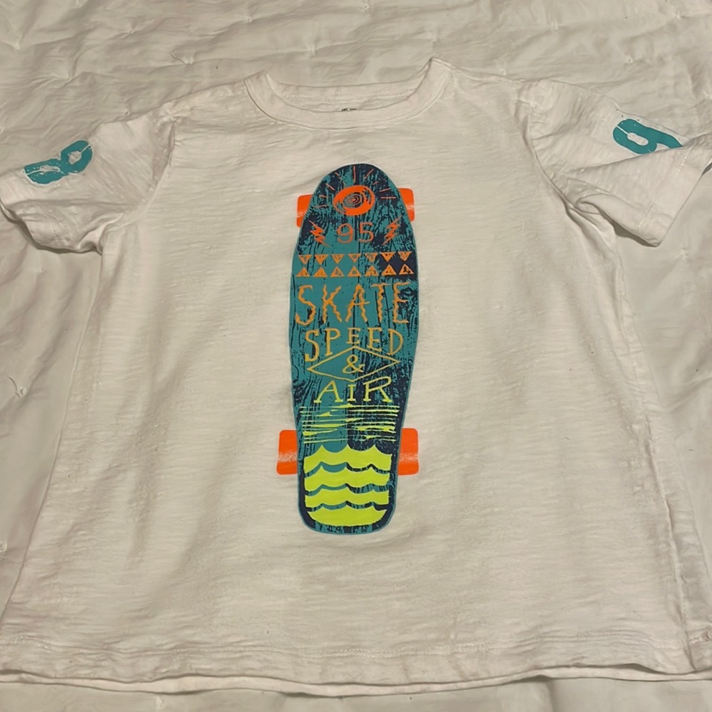 Boys OshKosh T-Shirt white with print on the front ant on both sleeves.